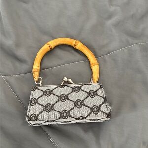 Elegant Black and White Handbag with Bamboo Handle